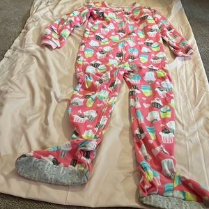 Carter’s footed PJs with cupcake design all over it